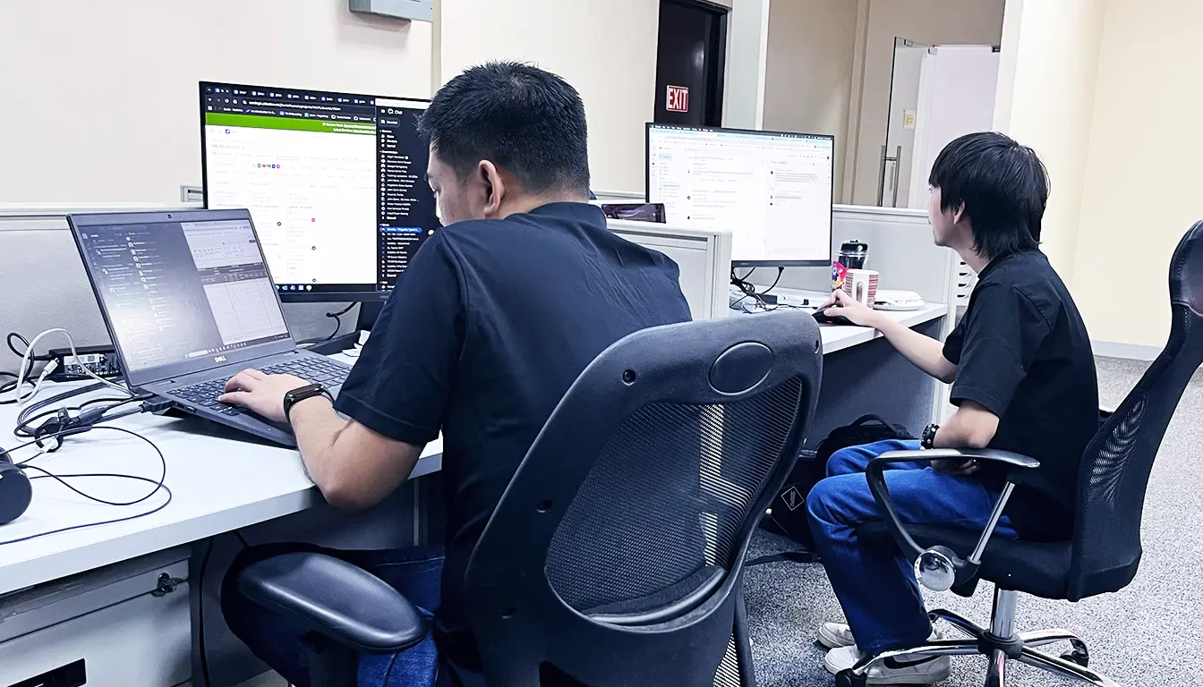 Enterprise engineering team reviewing an AI integration architecture on shared screens